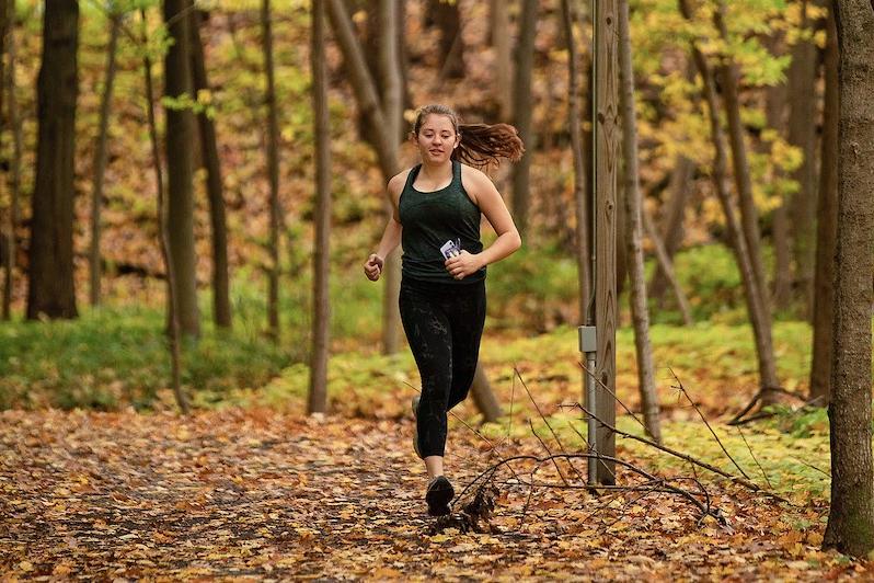 Student running on campus